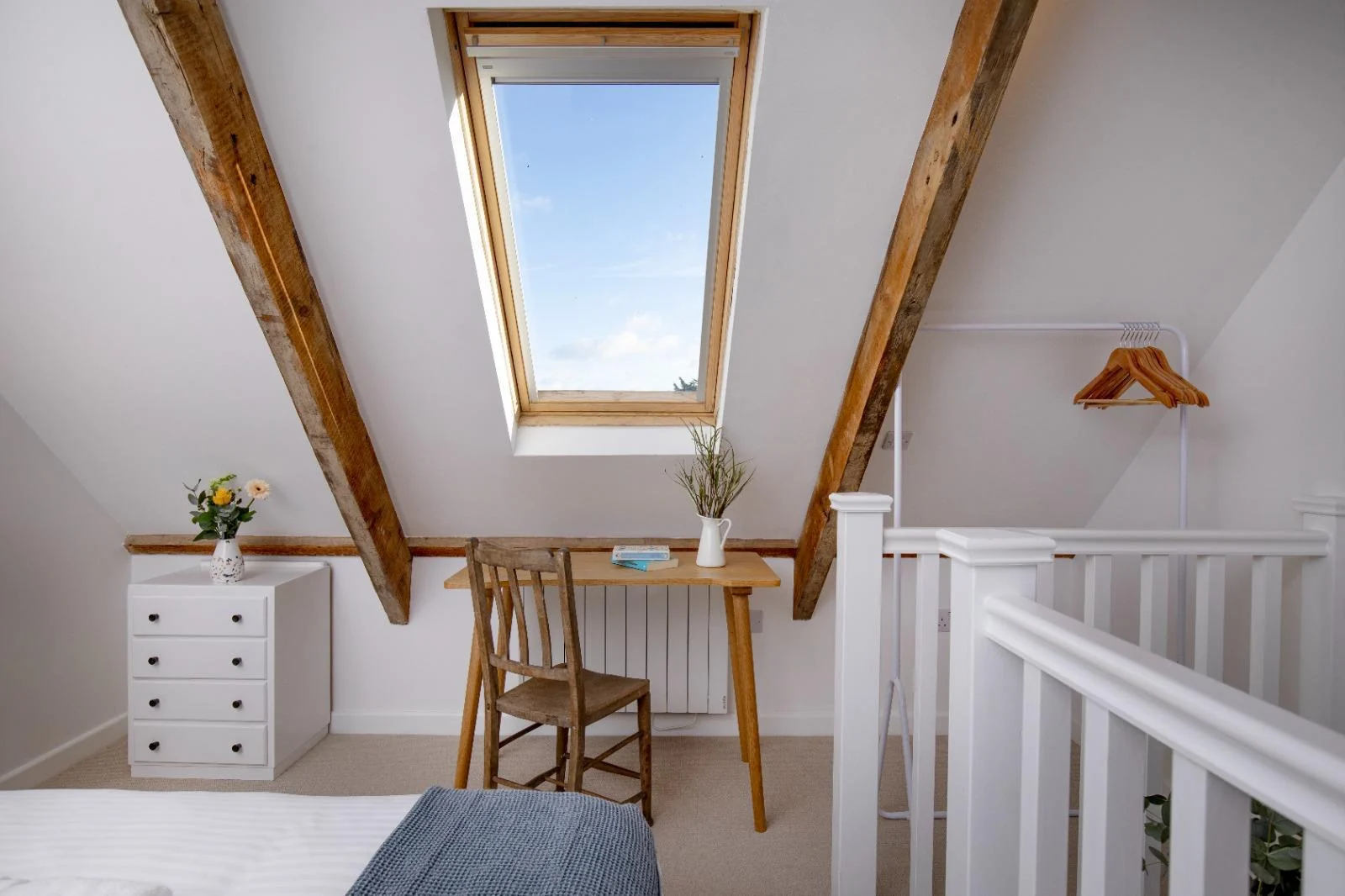 Top-floor desk, skylight and exposed beams