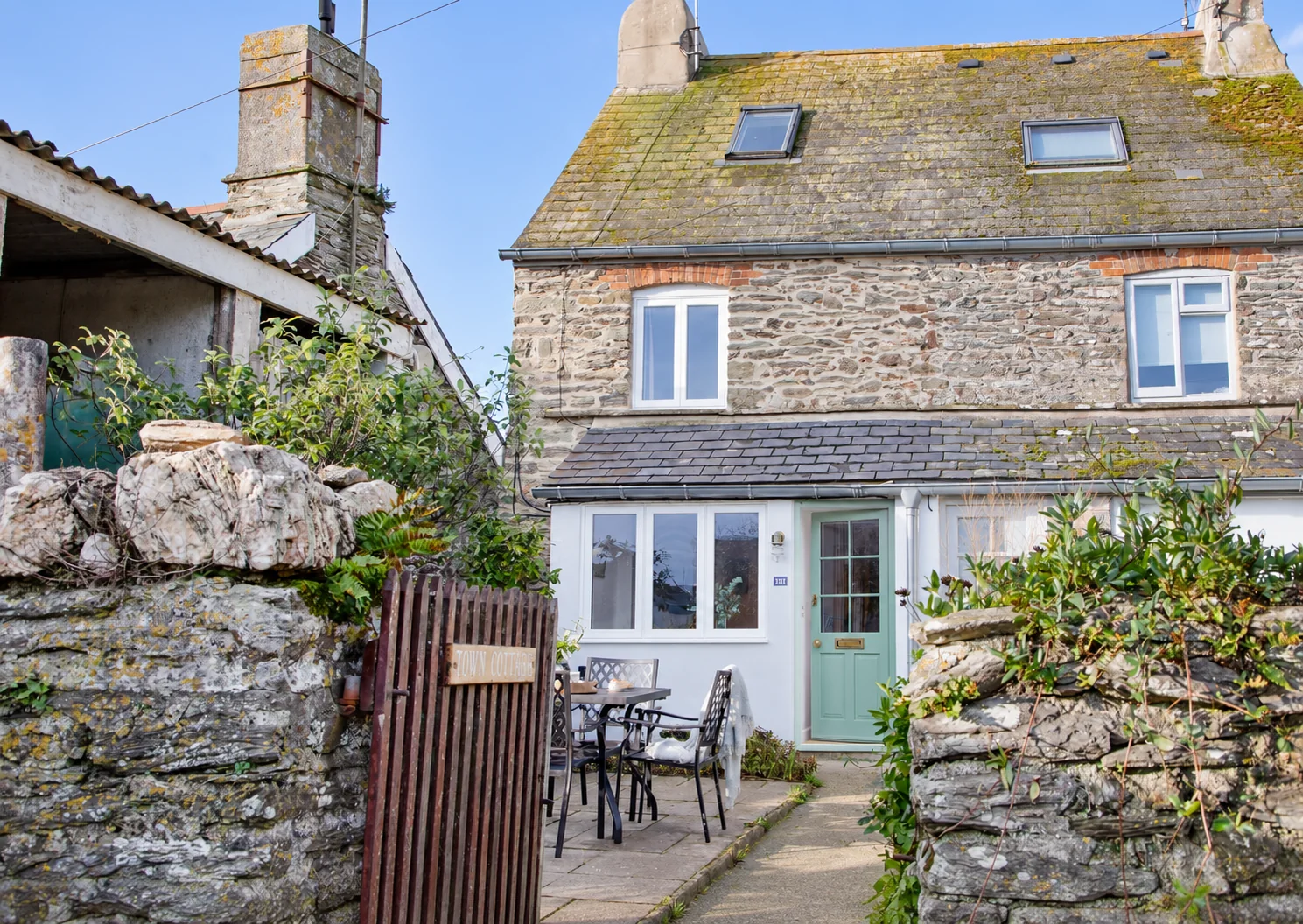 Sunny exterior of One Town Cottage in East Prawle