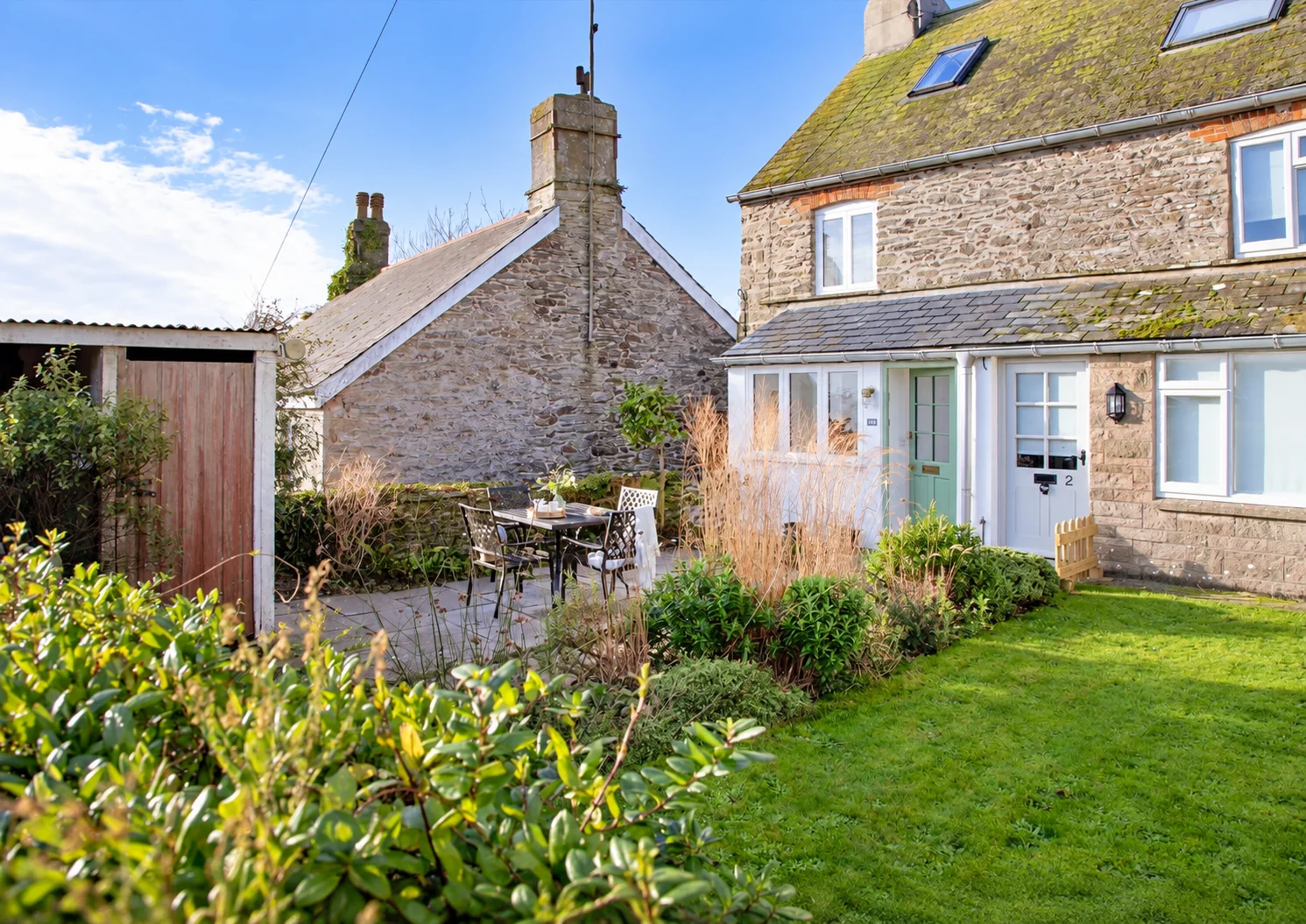 Sunny garden and exterior of One Town Cottage