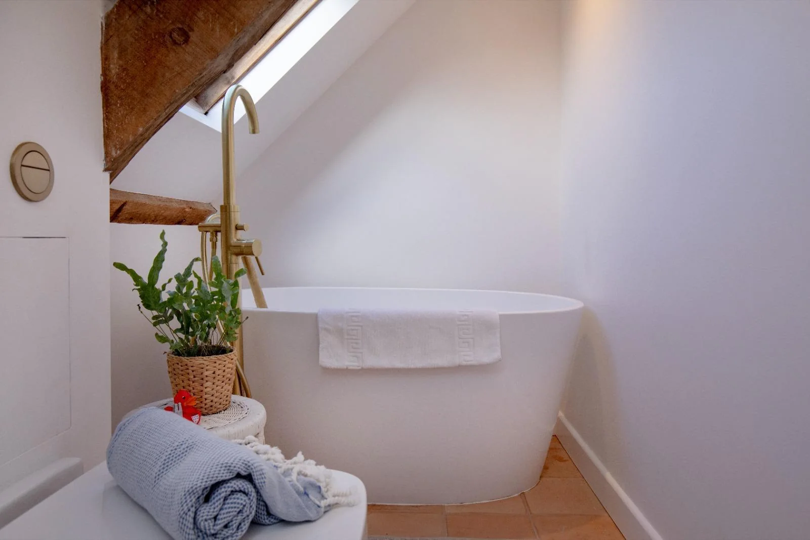 Top-floor bathroom with freestanding bath